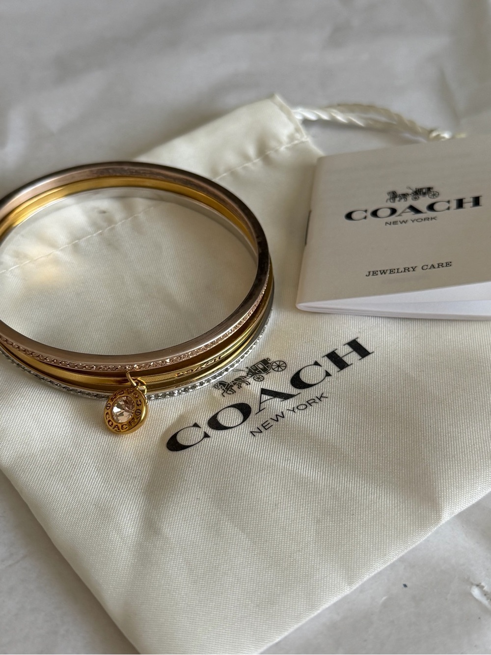 Coach Two-Tone Gold and Silver Stacked Bangle Set with Charm